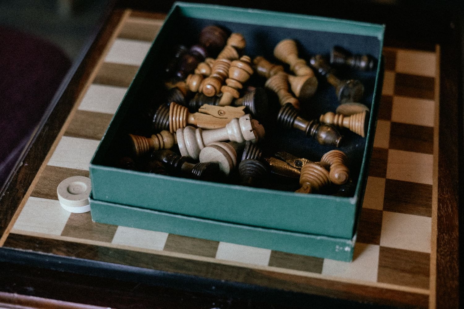 Chess pieces in a small open box