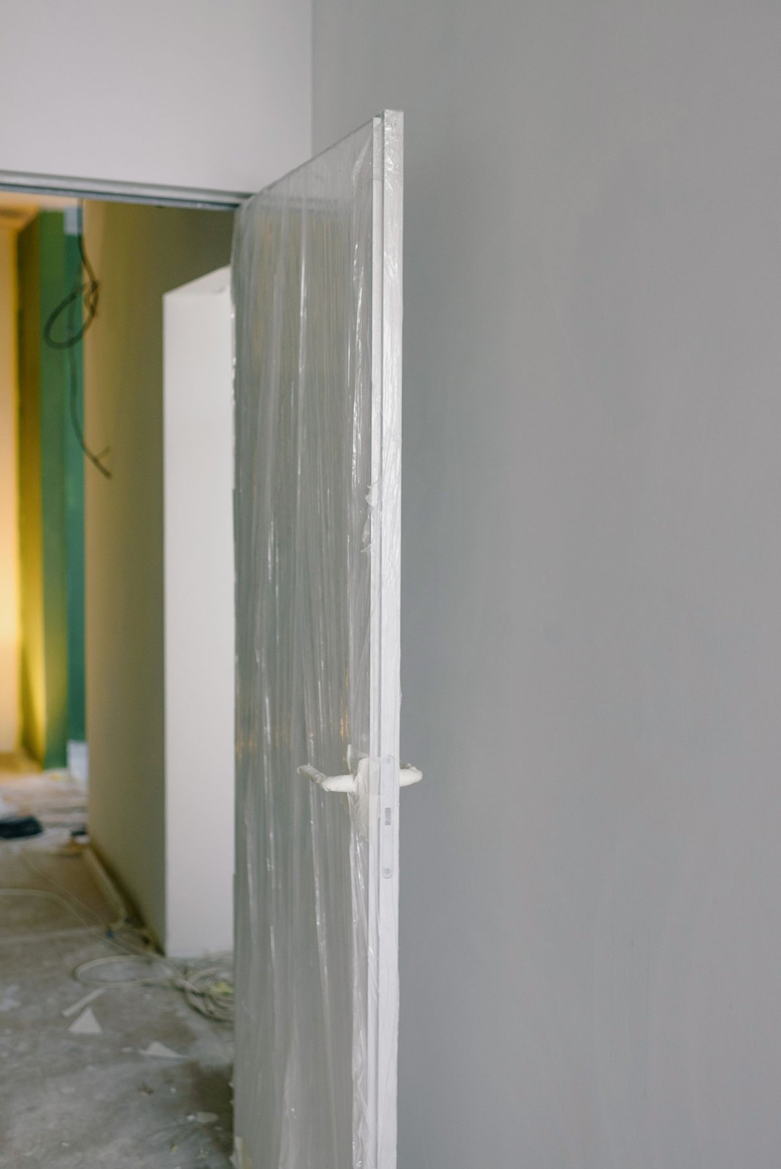 A door covered with protective film during renovation