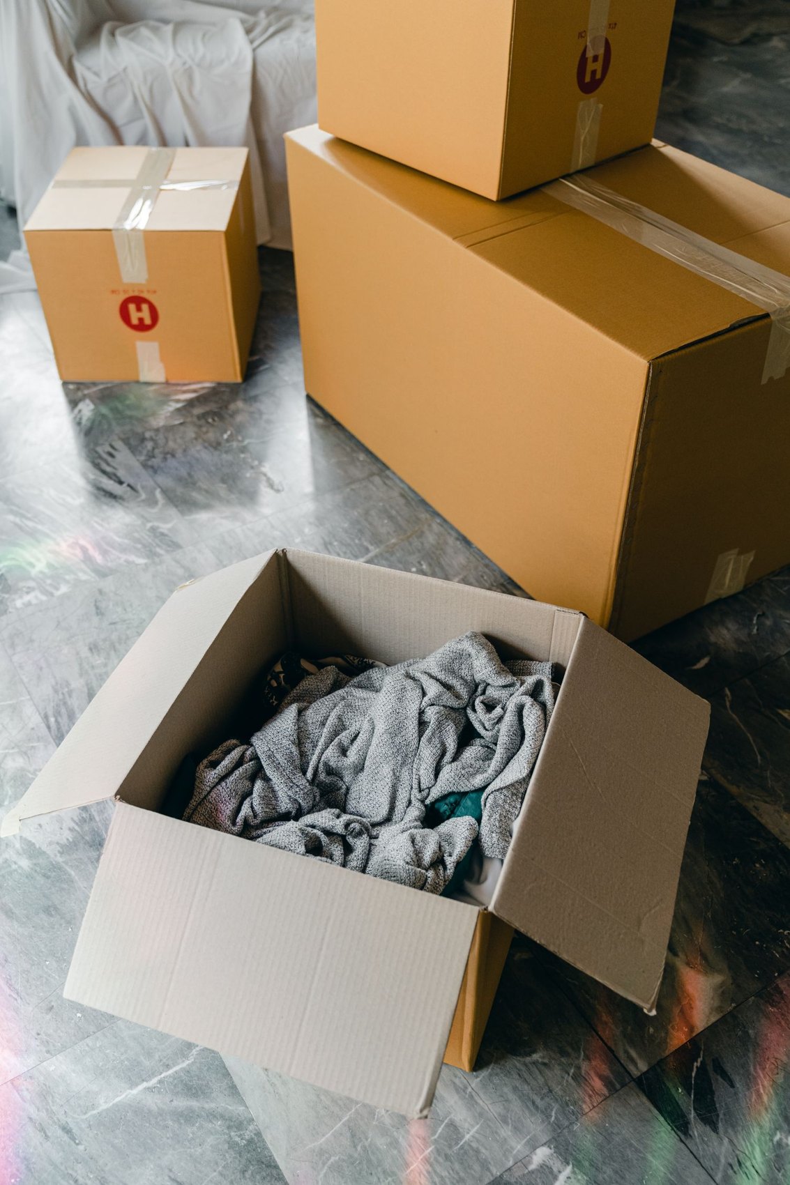 Moving boxes standing on a covered floor